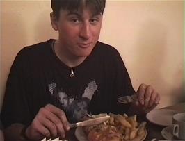 Tao assesses the home made pizza to be better than his Mum's at St Briavels Castle youth hostel